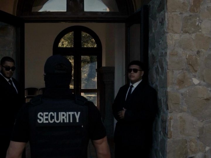 LDG security posted at a venue entrance with two agents