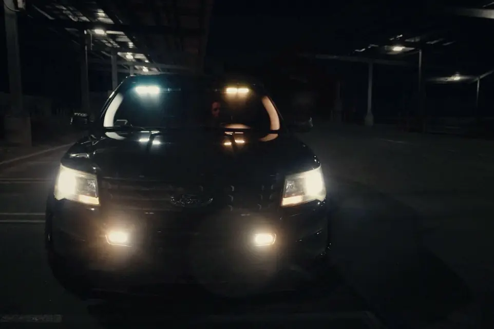 LDG patrol vehicle with lights on in a parking structure at night