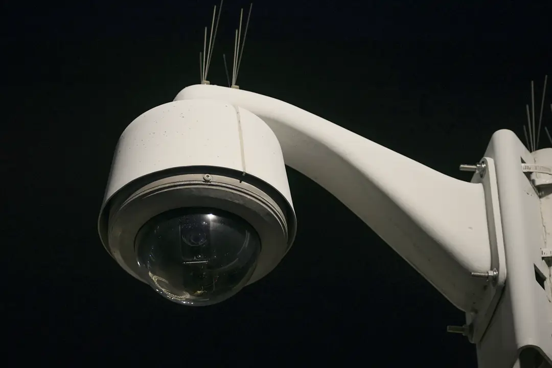 Close-up of a security camera on a pole