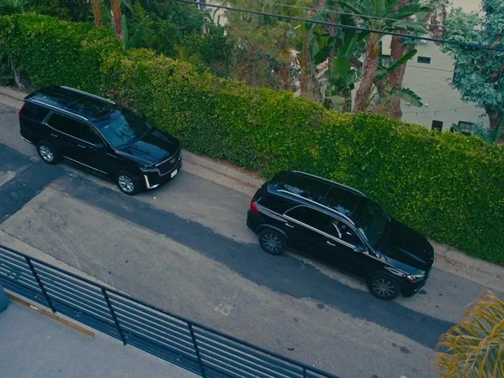 Black LDG vehicles staged on a residential street