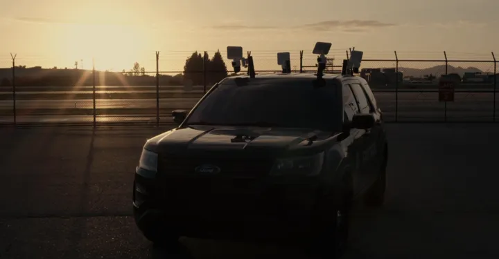 LDG surveillance vehicle with roof cameras at sunset